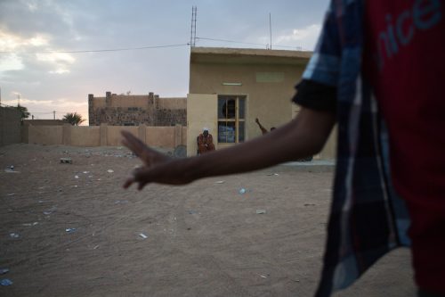 A young boy holds up his two fingers, a symbol for Azawad, in Kidal, Mali on 23 August 2013.  Rebels of the MNLA, Mouvement National de Liberation de l'Azawad, returned to the desert city of Kidal along with French forces and support in late January 2013.  It had been less than a year since the rebelsÕ brief occupation of the city in 2012, along with Gao and Timbuktu, fell to the Al-Qaeda linked groups they had previously been allied with.  While the Ouagadougou accords signed in June allowed for the return of about 200 Malian soldiers to the rebel stronghold before the holding of national elections in August, the MNLA have yet to disarm.  They continue to haphazardly administer the city and occupy government buildings.  If their demands for autonomy are not met in upcoming negotiations, they have asserted that they are prepared to retake arms and continue their fight for the creation of Azawad.  TANYA BINDRA/EPA