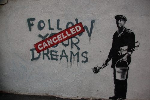 Banksy in Boston: F̶O̶L̶L̶O̶W̶ ̶Y̶O̶U̶R̶ ̶D̶R̶E̶A̶M̶S̶ CANCELLED, Essex St, Chinatown, Boston. Credit: Chris Devers. Uploaded from Flickr and used under Creative Commons – Attribution, NonCommercial, NoDerivatives.