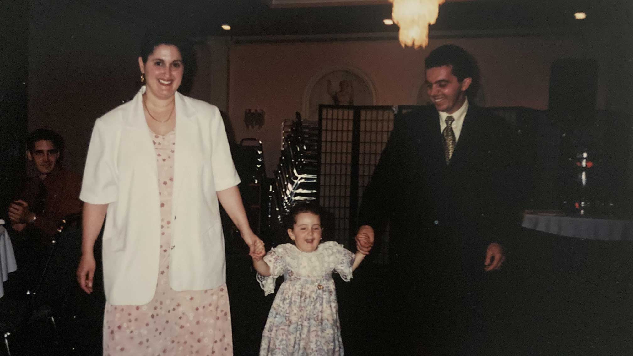 Family photo of the poet with her parents, June 13, 1999