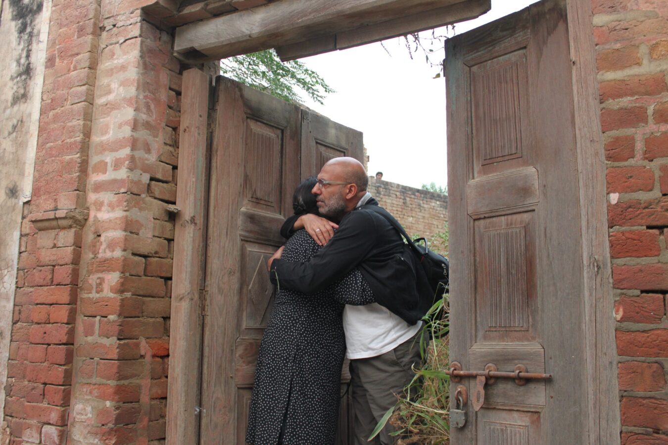 Himmat & Surjit in the doorway of the ruins of the house that Surjit's family abandoned in 1947 at the time of the Partition of India, 2011© René Tousignant